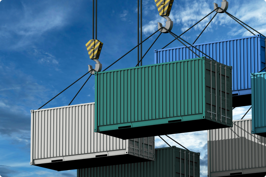 Shipping containers being lifted by a forklift